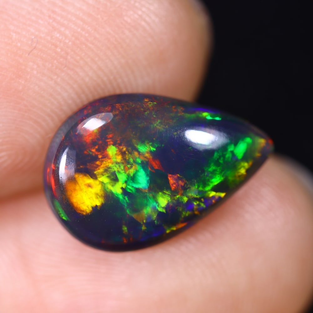 2.67Ct Natural Ethiopian Black Opal - 14.2x9.6x4.1 mm , 609C: Ksmith Heritage Auctioneers Subject: Natural Ethiopian Welo Opal Origin: Ethiopia Treatment: Smoked
