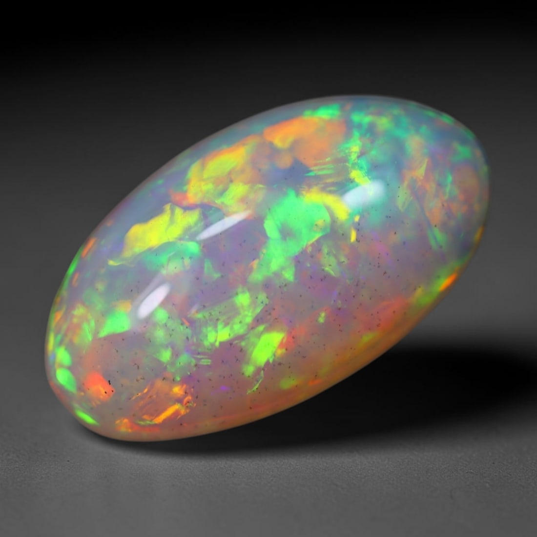 *5.28Ct Welo Opal Polished - Ethiopian Opal, 1135B: Ksmith Heritage Auctioneers Subject: Natural Ethiopian Welo Opal Origin: Ethiopia Carat Weight: 5.28Ct Dimension: 16.9x9.5x6.2 mm Treatment: Natural Untreated Type: Cabochon, P