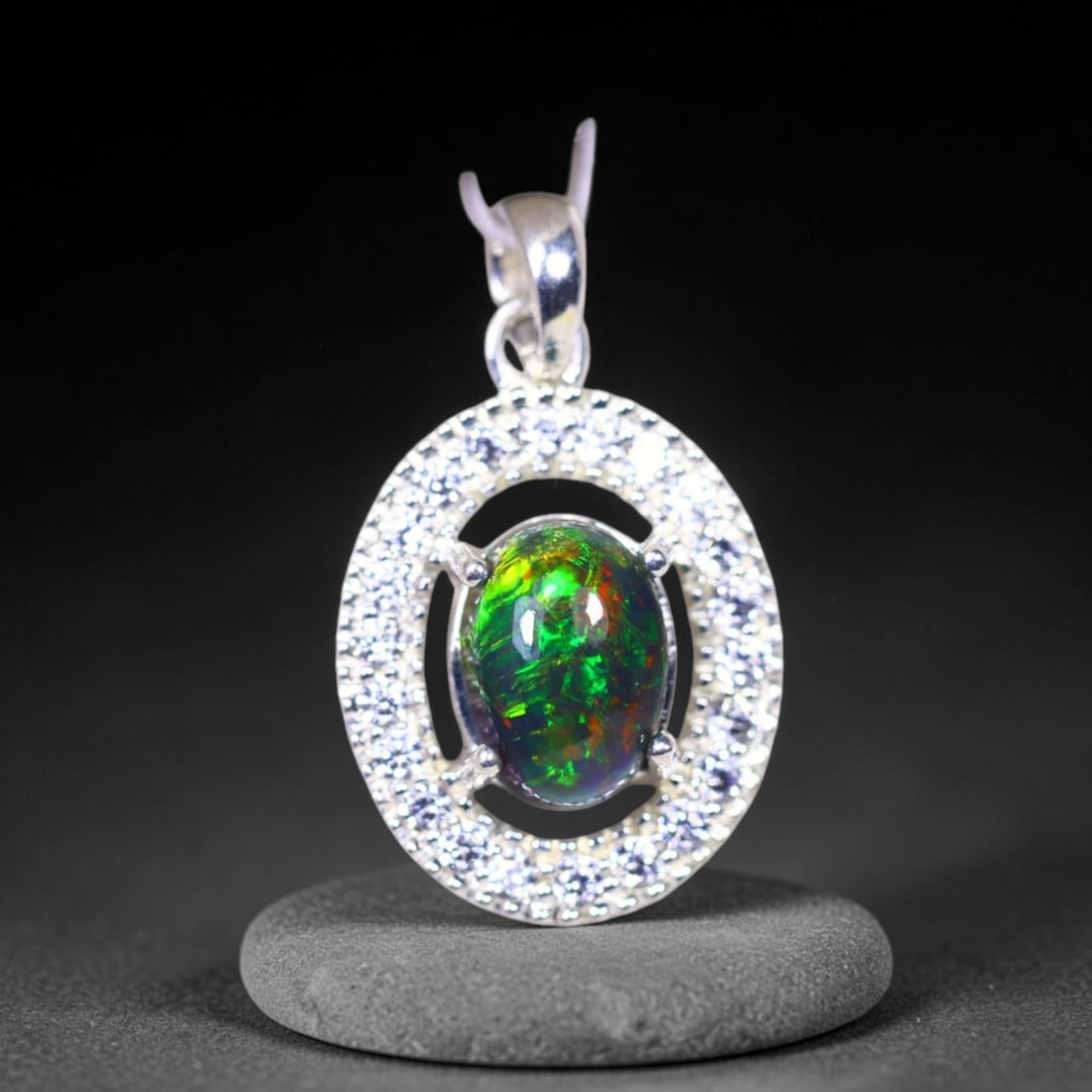 Silver Pendant with Ethiopian Black Opal 3.5grams - 925 Sterling Silver , 754E: Ksmith Heritage Auctioneers Subject: Opal & Simulated Diamond Silver Pendant Carat Weight: 3.5 grams (approx.) Dimension: Opal 10x7mm, Pendant 22x15mm