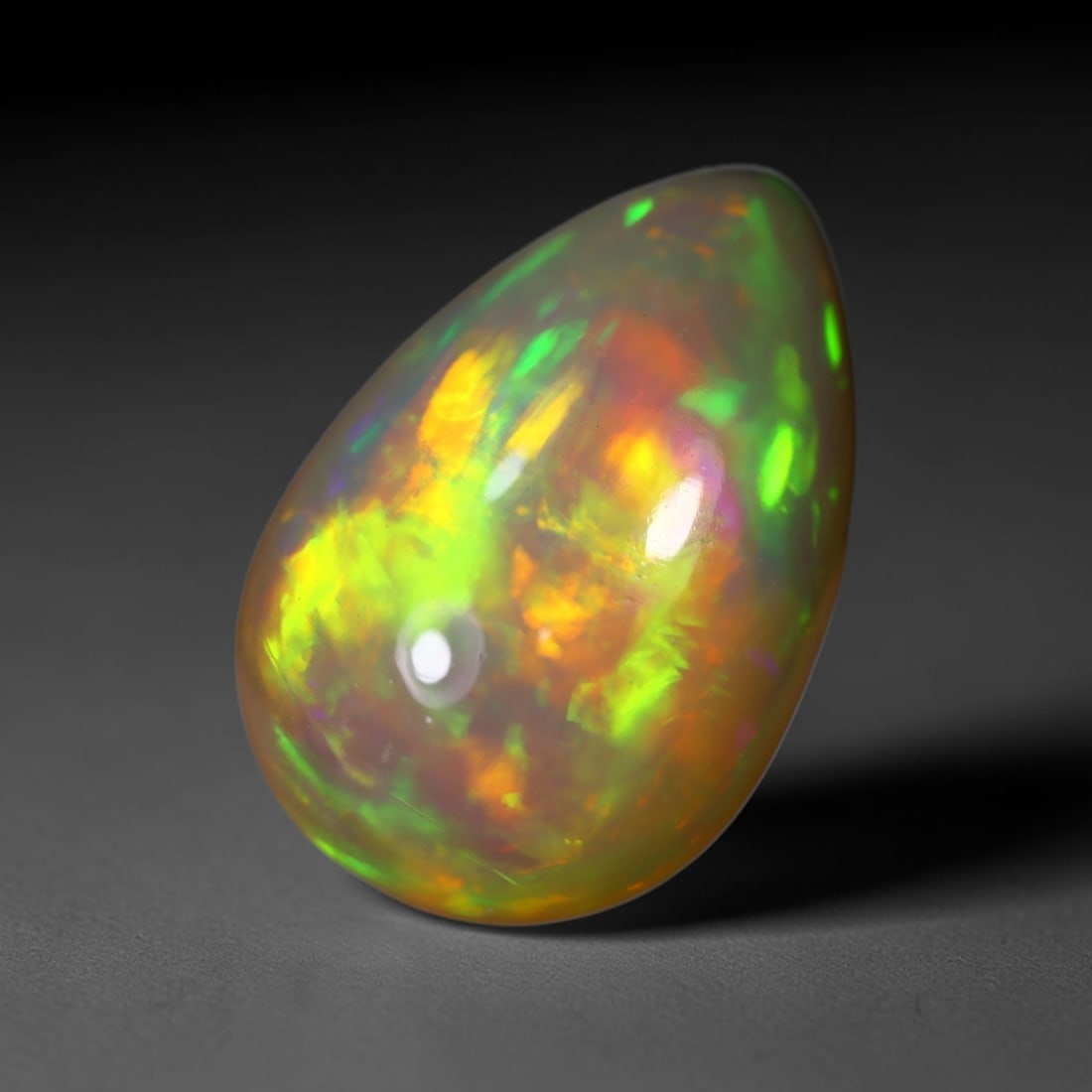 *6.69Ct Welo Opal Polished - Ethiopian Opal , 413C: Ksmith Heritage Auctioneers Subject: Natural Ethiopian Welo Opal Origin: Ethiopia Carat Weight: 6.69Ct Dimension: 17x11.4x7.3 mm Treatment: Natural Untreated Type: Cabocho