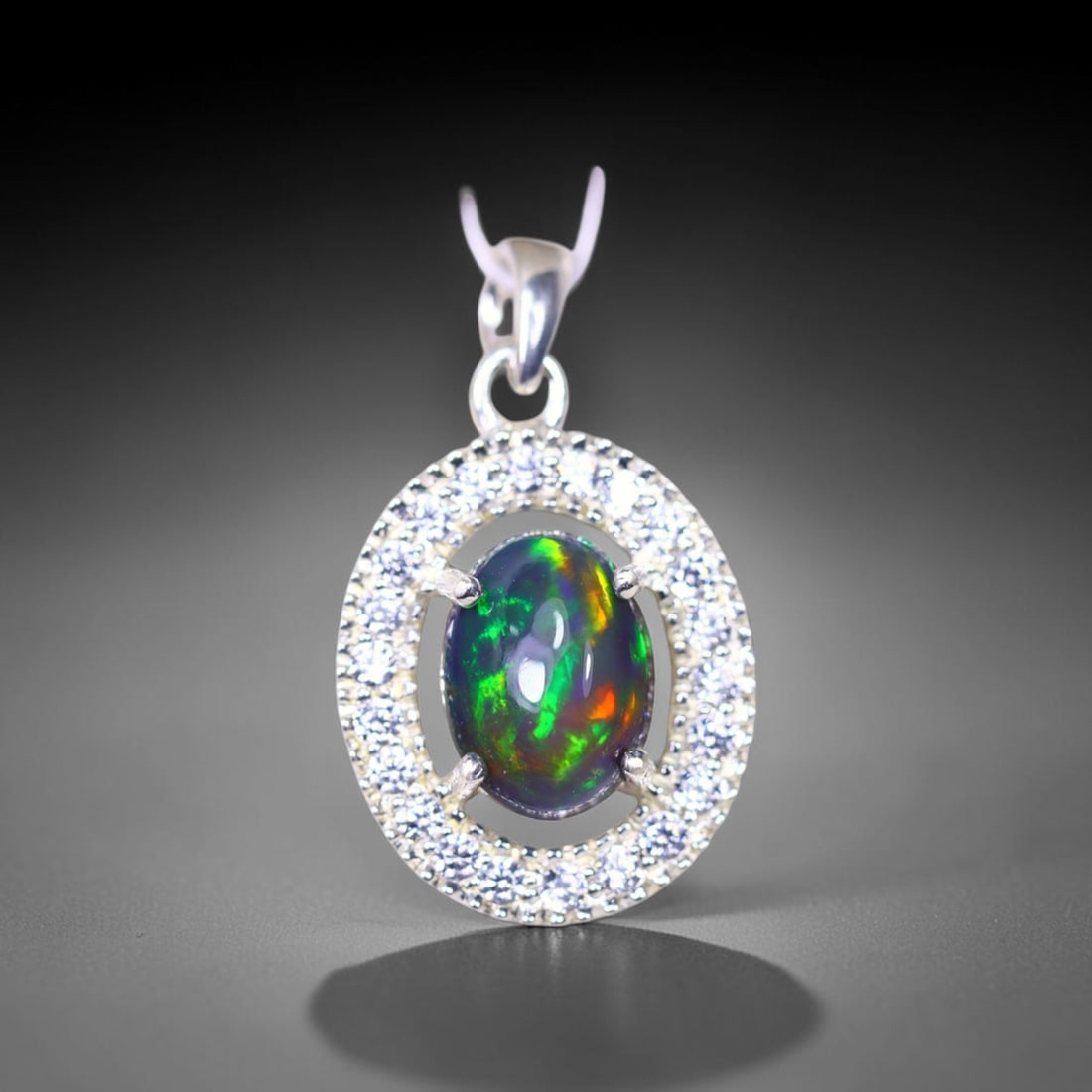 Silver Pendant with Ethiopian Black Opal 3.5grams - 925 Sterling Silver, 427B: Ksmith Heritage Auctioneers Subject: Opal & Simulated Diamond Silver Pendant Carat Weight: 3.5 grams (approx.) Dimension: Opal 10x7mm, Pendant 22x15mm