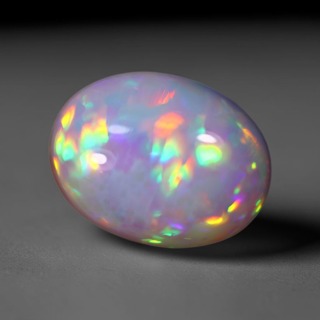 *5.43Ct Welo Opal Polished - Ethiopian Opal , 456C: Ksmith Heritage Auctioneers Subject: Natural Ethiopian Welo Opal Origin: Ethiopia Carat Weight: 5.43Ct Dimension: 14.1x10.9x7.3 mm Treatment: Natural Untreated Type: Cabochon, Polished
