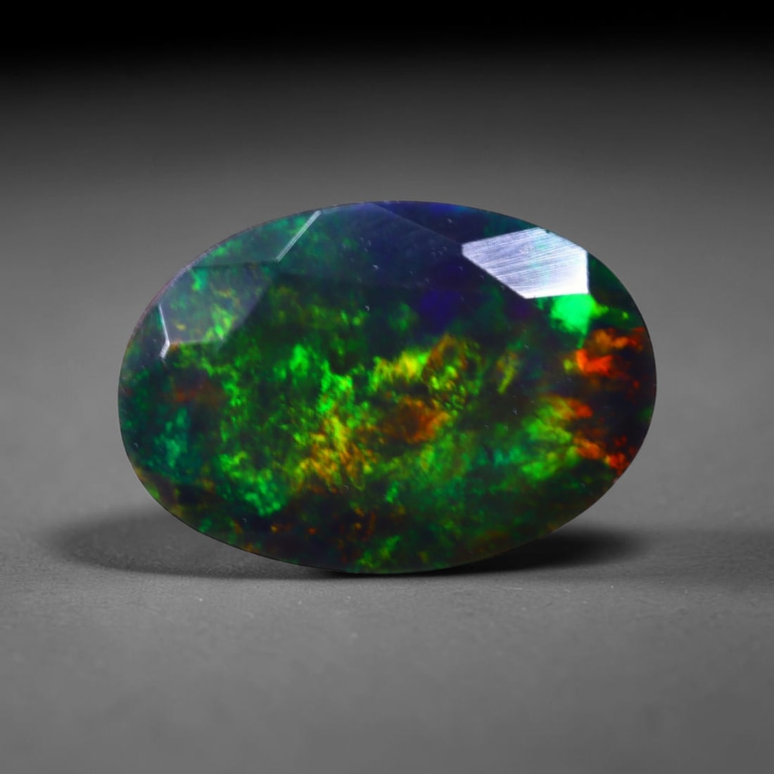 1.48 Ct Black Opal Faceted Cut Polished - Ethiopian Opal - 10x7mm , 926C: Ksmith Heritage Auctioneers Subject: Natural Ethiopian Welo Black Opal Origin: Ethiopia Treatment: Smoked