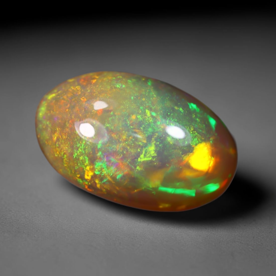 *7.78Ct Welo Opal Polished - Ethiopian Opal , 423C: Ksmith Heritage Auctioneers Subject: Natural Ethiopian Welo Opal Origin: Ethiopia Carat Weight: 7.78Ct Dimension: 17.7x11.2x8 mm Treatment: Natural Untreated Type: Cabocho