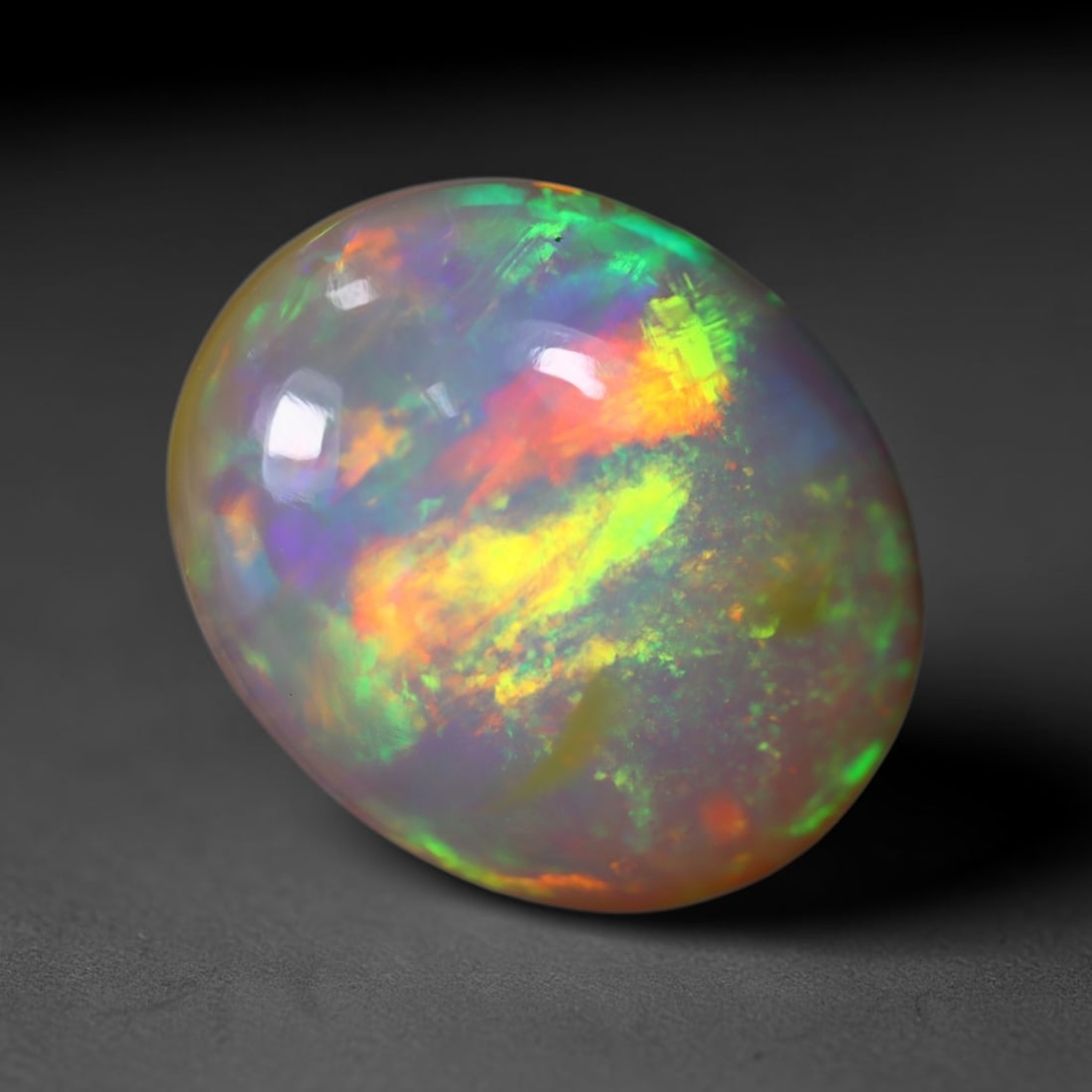 *4.55Ct Welo Opal Polished - Ethiopian Opal , 460C: Ksmith Heritage Auctioneers Subject: Natural Ethiopian Welo Opal Origin: Ethiopia Carat Weight: 4.55Ct Dimension: 13.8x11.2x5.9 mm Treatment: Natural Untreated Type: Caboc