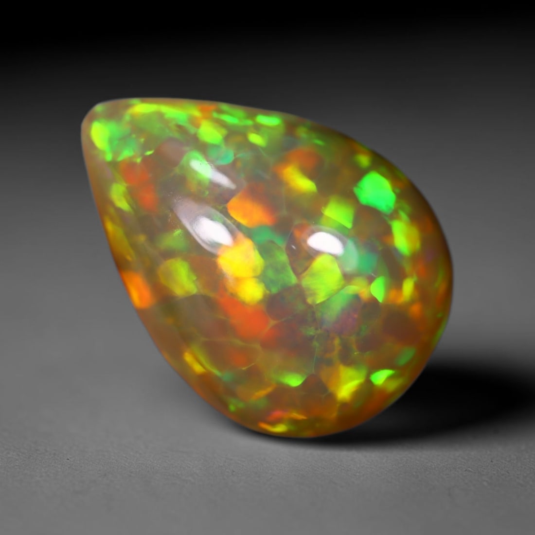 *7.43Ct Welo Opal Polished - Ethiopian Opal , 428C: Ksmith Heritage Auctioneers Subject: Natural Ethiopian Welo Opal Origin: Ethiopia Carat Weight: 7.43Ct Dimension: 18.1x13.2x7.8 mm Treatment: Natural Untreated Type: Caboc