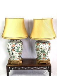 A pair of Chinese Famille Vert porcelain table lamps from the Qing Dynasty, Kangxi period