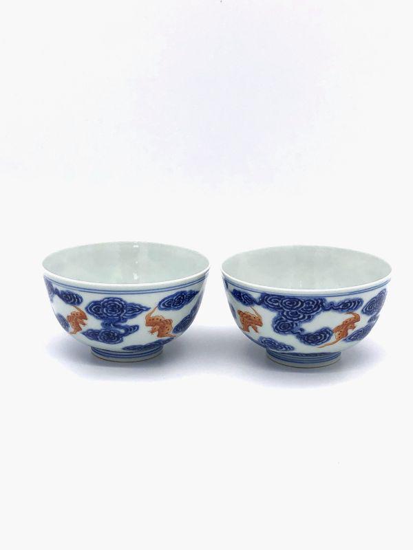 Pair of Blue and White Porcelain Bowls with Iron Red Bats: Beautiful pair of blue and white glazed porcelain bowls with iron red bats design. Late 19th CenturyMeasurements: Diameter 4",H 2.25"