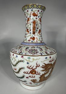 Chinese Famille Rose Vase with Dragon: The vase measures 10.75 inches in height and 6.5 inches in width.