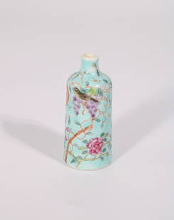 A Chinese Da Ya Zhai Famille Rose Celadon Snuff Bottle, Yong Qing Chang Chun Mark, 19th Century: A green Da Ya Zai snuff Bottle. The bottom is signed Yong Qing Chang Chun. It's 3.125 inches tall and 1.375 inches wide.