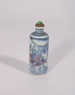 A Chinese Blue, White, and Underglaze Red Snuff Bottle with Jade Cap, 19th Century: The snuff bottle is 3.75 inches tall and has a diameter of 1.25 inches.