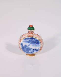 A Gilt Iron Red, Blue And White Snuff Bottle with Coral and Jade cap, Hong Xian Mark, Republic: A red and blue snuff bottle with a green jade and red coral cap. Height: 2 inches Width: 1.85 inches