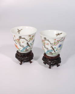 A Pair of Chinese Famille Rose Cups on Wooden Bases: The cups are 2.43 inches tall, discluding the wooden base and the diameter is 3 inches.