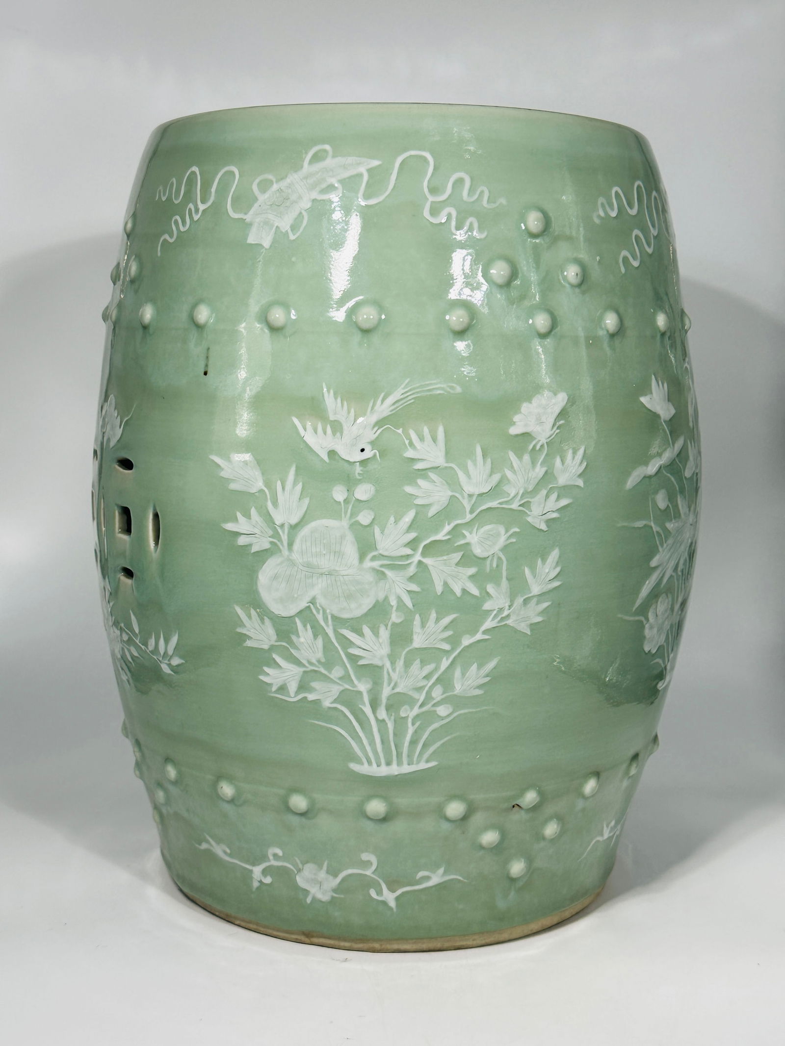 A Chinese Bean Glazed Porcelain Stool: Height: 19 in. Width: 14 in. Provenance: From a collector in Chicago.
