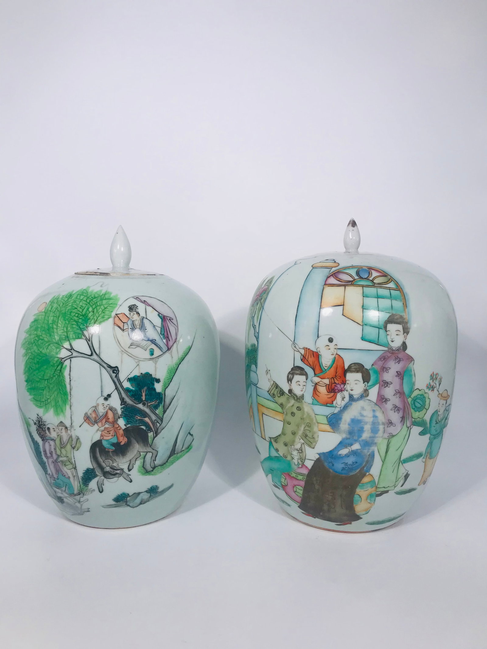 Two Chinese Famille Rose Jars, Qing Dynasty: The taller jar has a height of 12 inches, and a width of 8 inches. The shorter jar has a height of 11.5 inches, and a width of 7.75 inches. Provenance: From Buffalo, NY