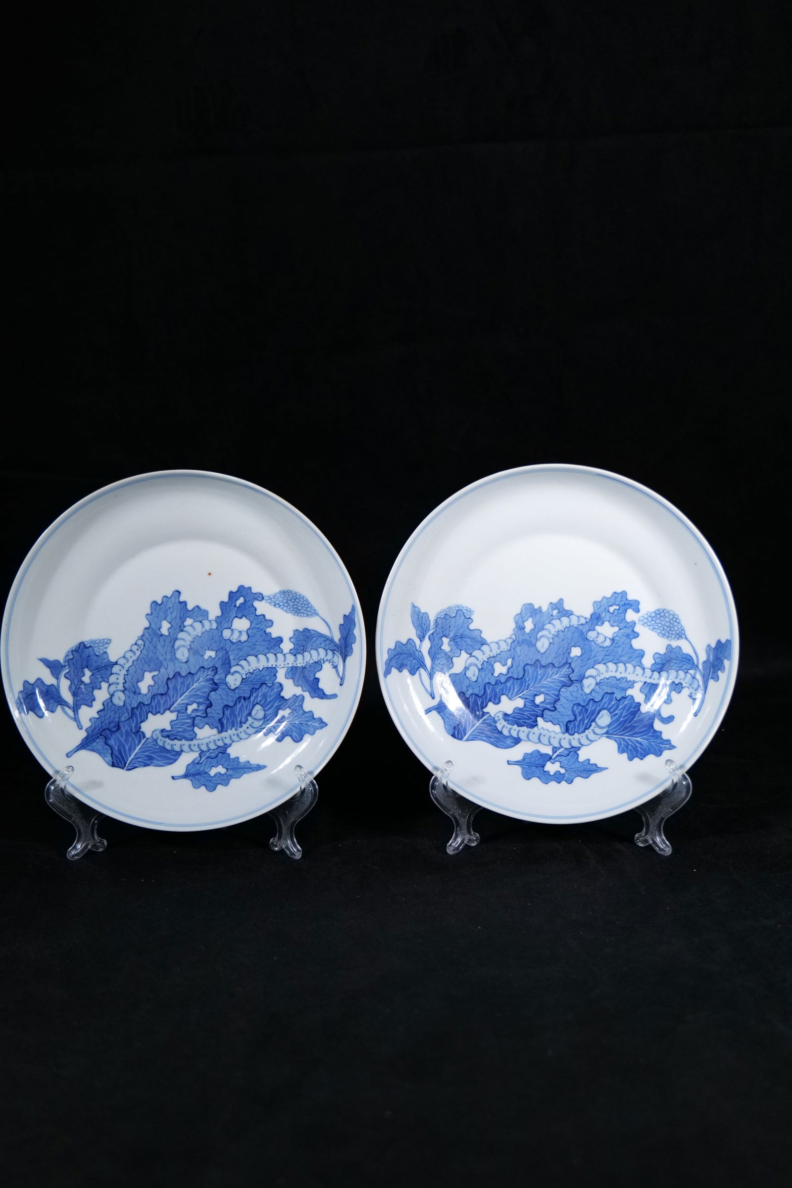 A Pair of Blue and White 'Silkworm and Mulberry' Dishes, Late Qing Dynasty: 7.1/2 in. (19.3 cm.) diam. each.
