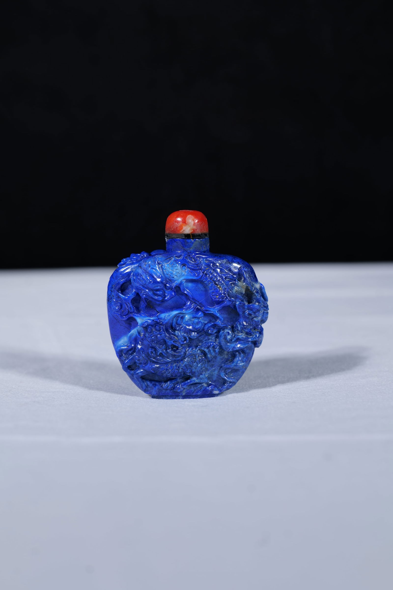 A Carved Lapis Lazuli 'Lion' Snuff Bottle (1 of 5)