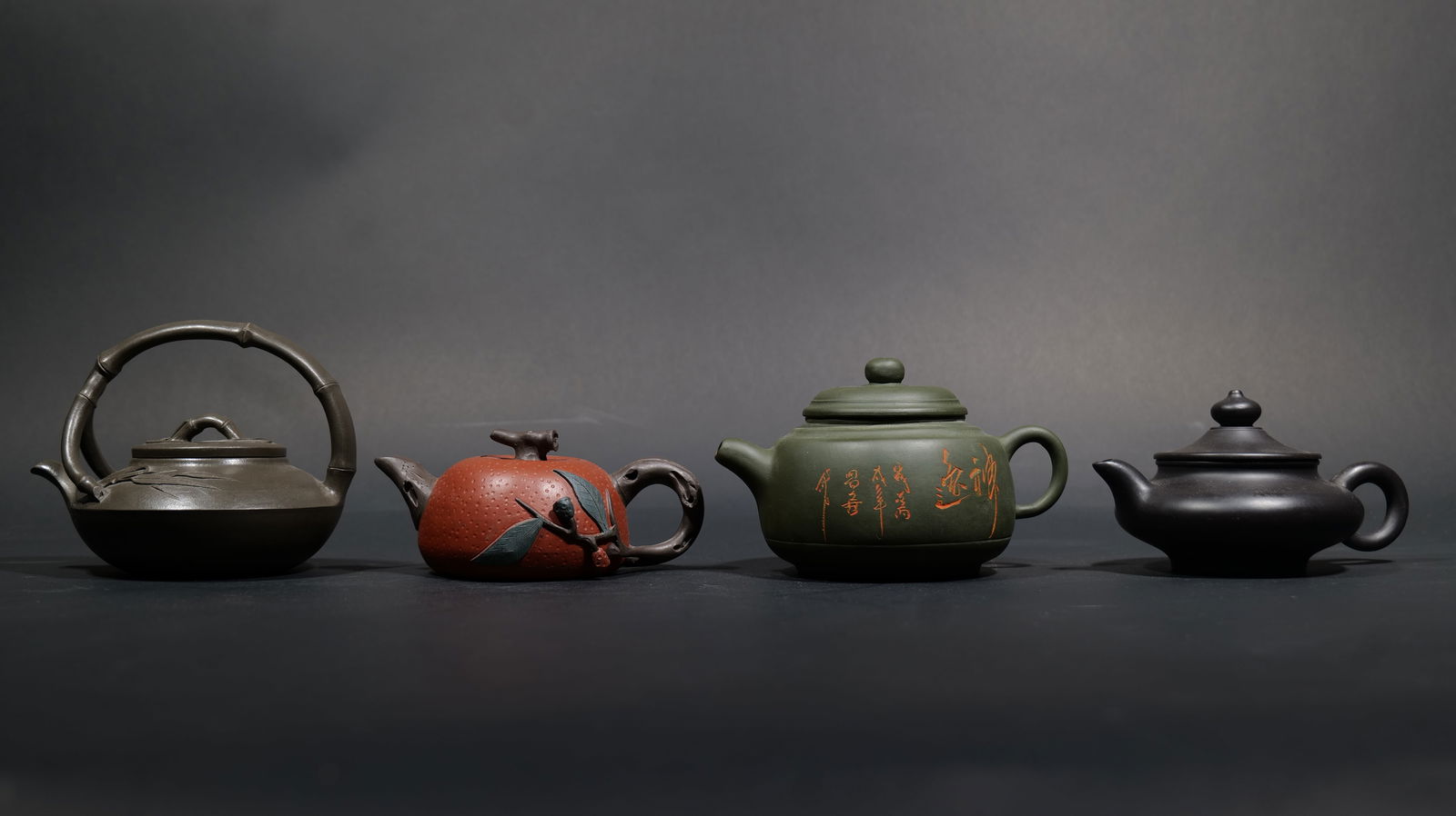 A Group of Four Yixing Zisha Teapots and Covers (1 of 20)