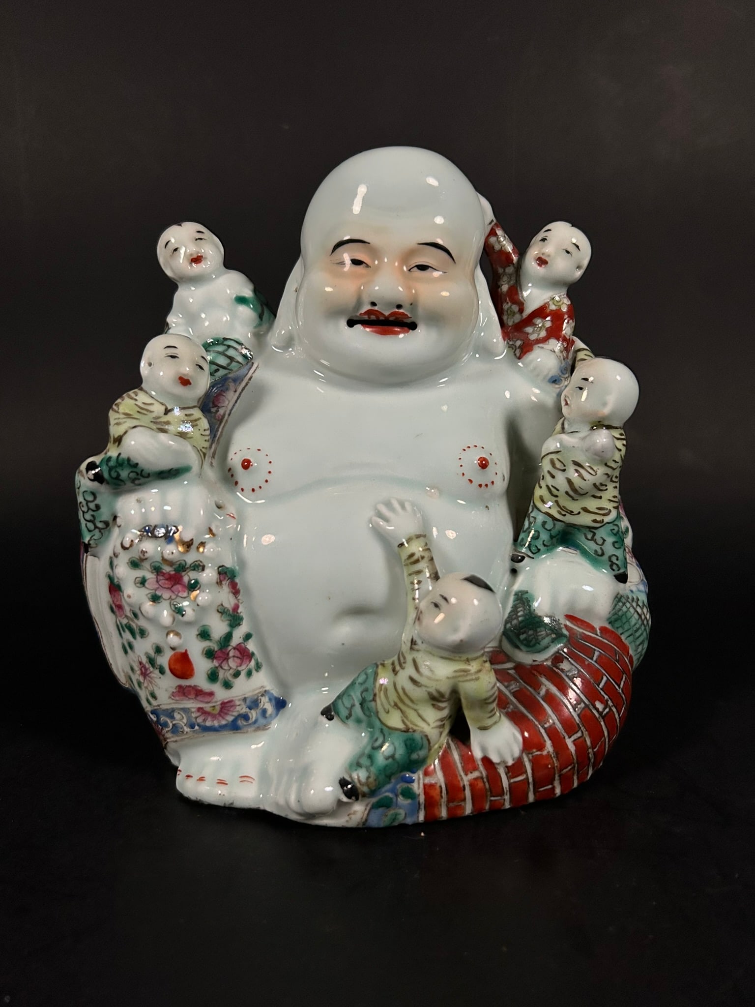 A Chinese Famille Rose 'Budai and Boys' Group, Republic Period (1 of 9)