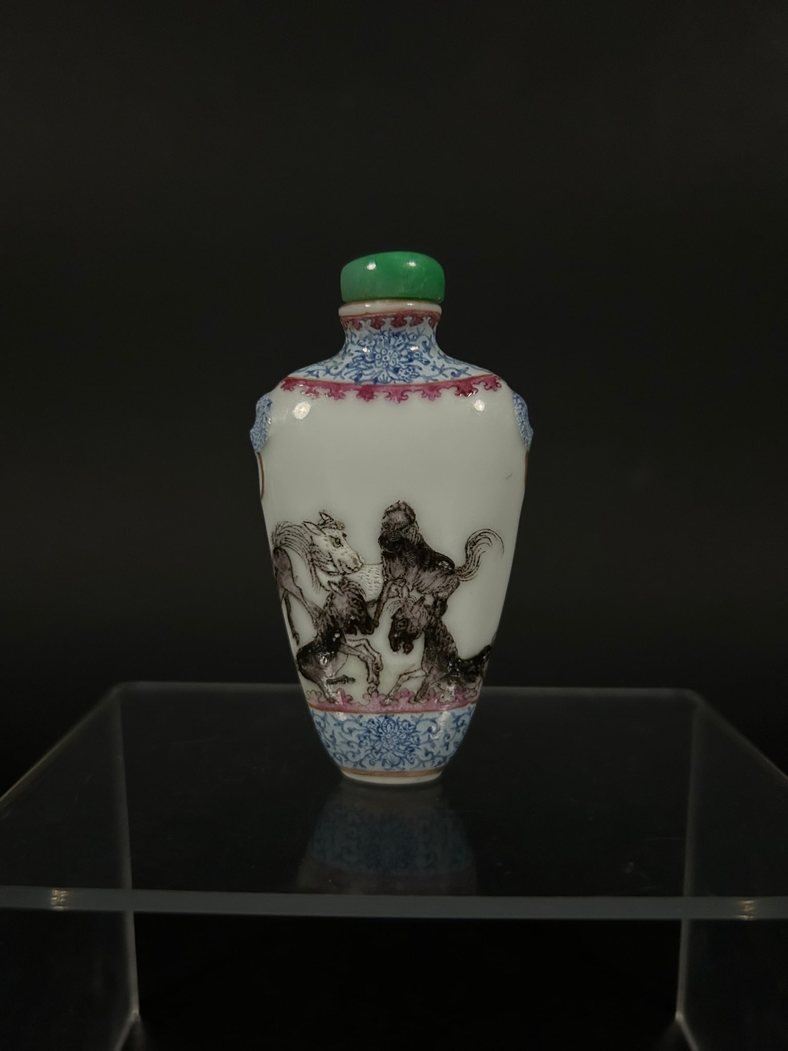 A Chinese Famille Rose and Underglaze-blue-decorated 'Horses' Snuff Bottle: 3 in. (7.6 cm.) high, 1.9/16 in. (4 cm.) wide.