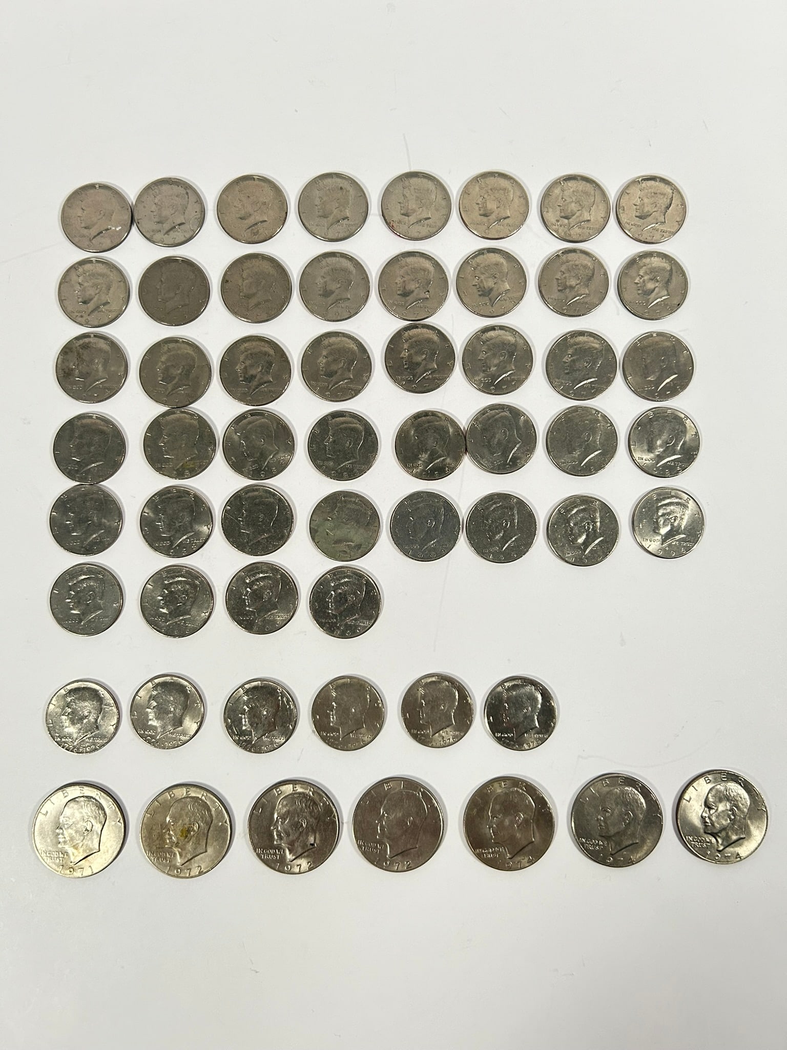 A Group of Fifty-Seven US Dollar/Half Dollar Coins (1 of 16)