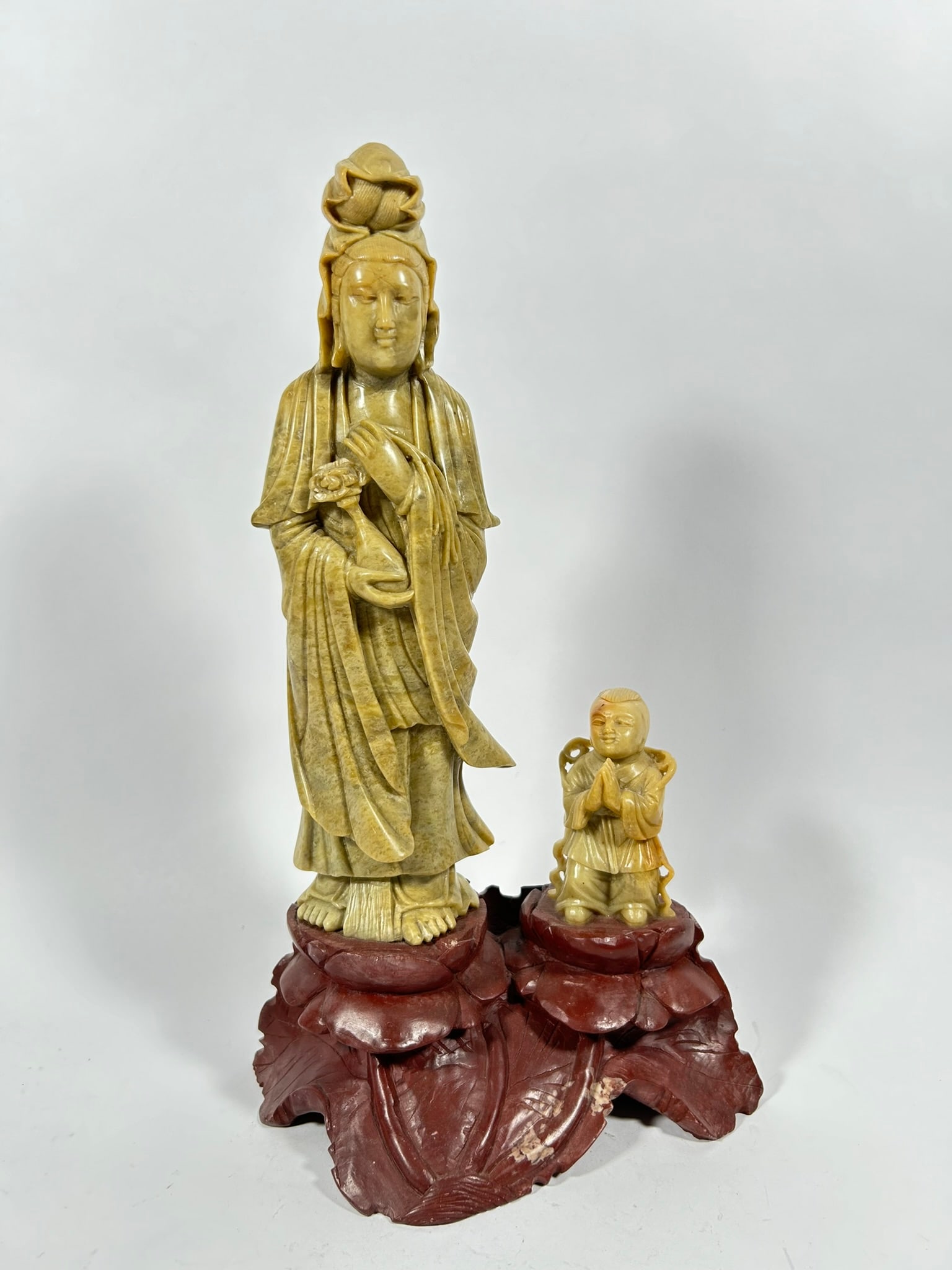 A Chinese Shoushan Carving of Guanyin and Boy: 13.8 in. high, 7.25 in. wide.