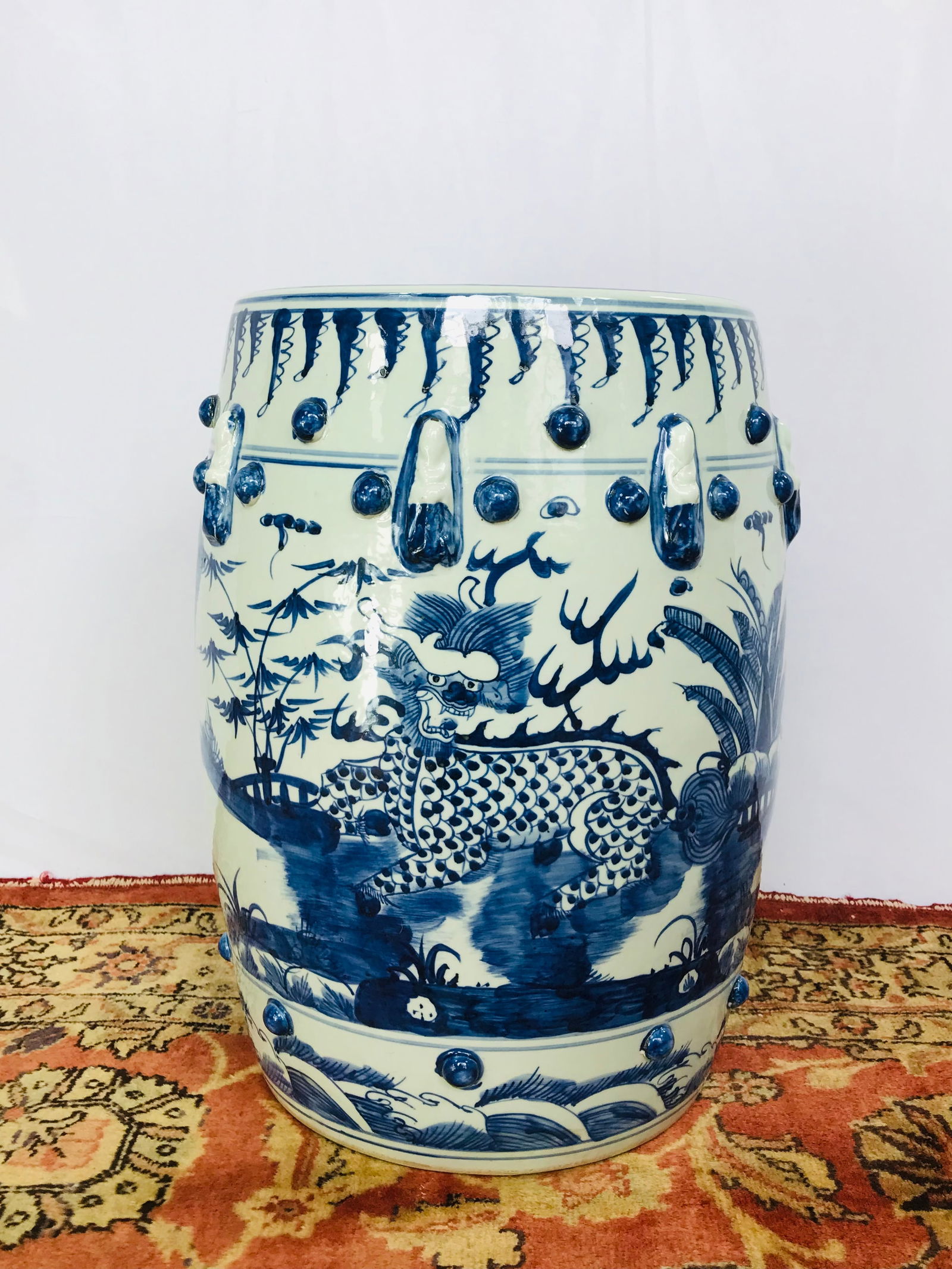 A Chinese Blue and White 'Dragon' Garden Stool: 17.3/4 in. (45.1 cm.) high, 13.3/8 (34 cm.) in. wide. No reserve price.