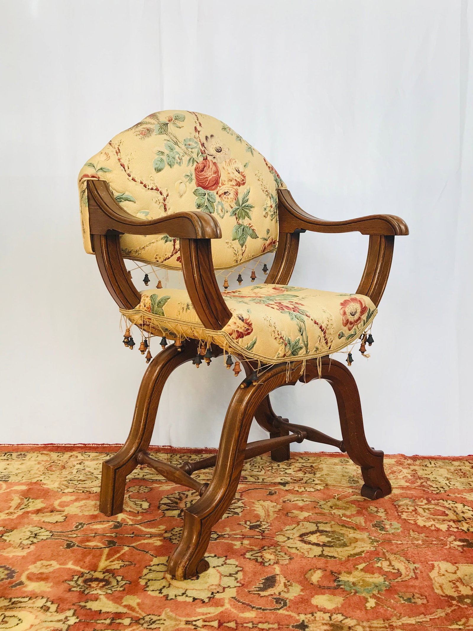 An Vintage French/Italian Curule-Form Armchair: 33.1/2 in. high, 21.1/2 in. wide, 17 in. deep.