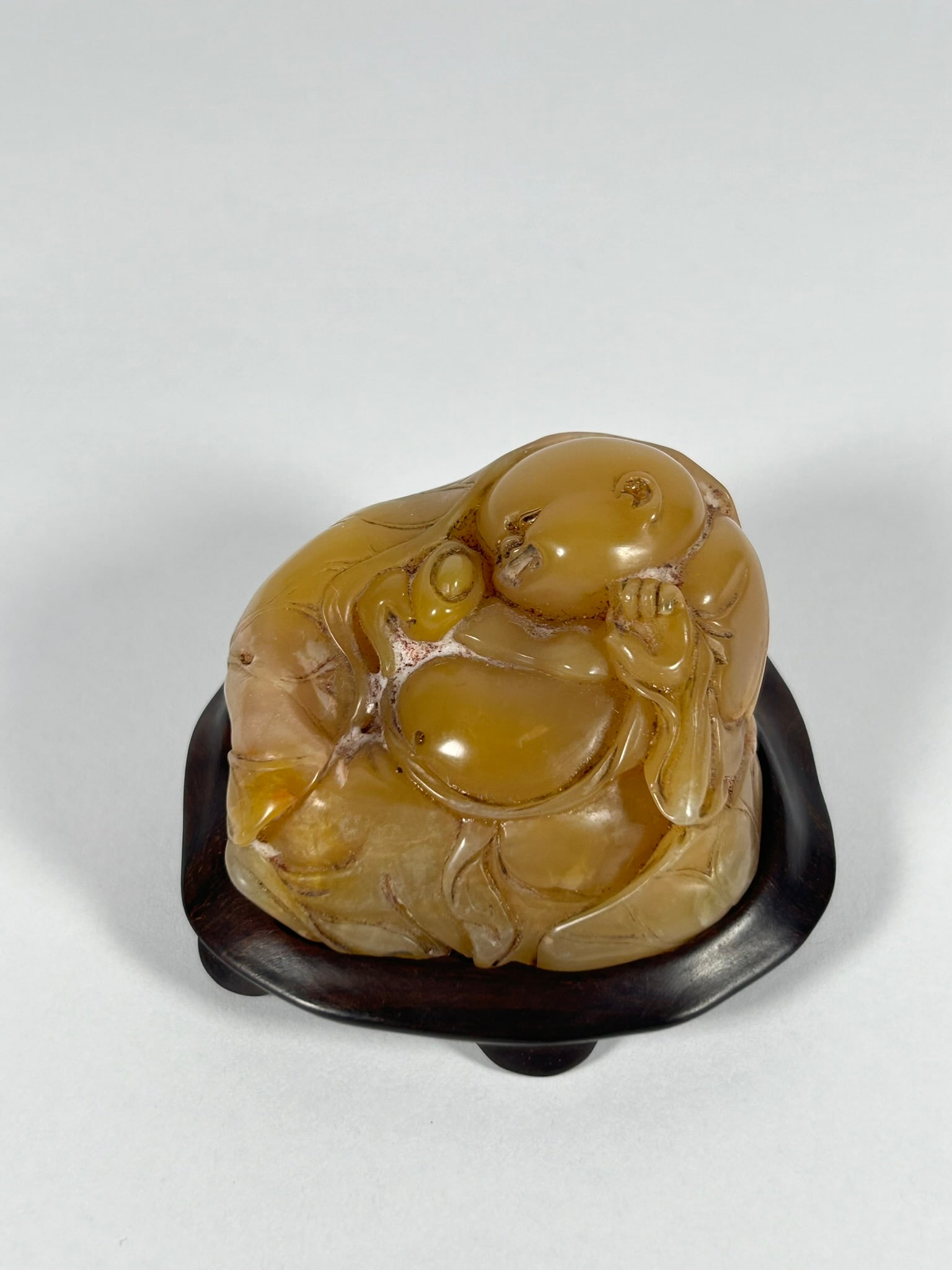 A Chinese Carved Shoushan Soapstone Figure of Budai, with Zhou Zuzhu's Mark (1 of 9)