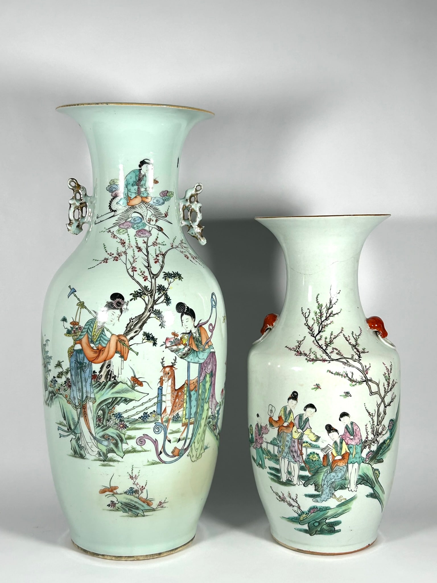 Two Chinese Famille Rose 'Ladies' Vases: Comprising a smaller vase depicting four ladies and one child under a treen in a garden setting, with inscription and a signature of the workshop, 17.1/8 in. high, 7.3/4 in. wide; a larger vase depict