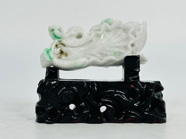 A Chinese Carved Jadeite Cabbage with Wooden Base