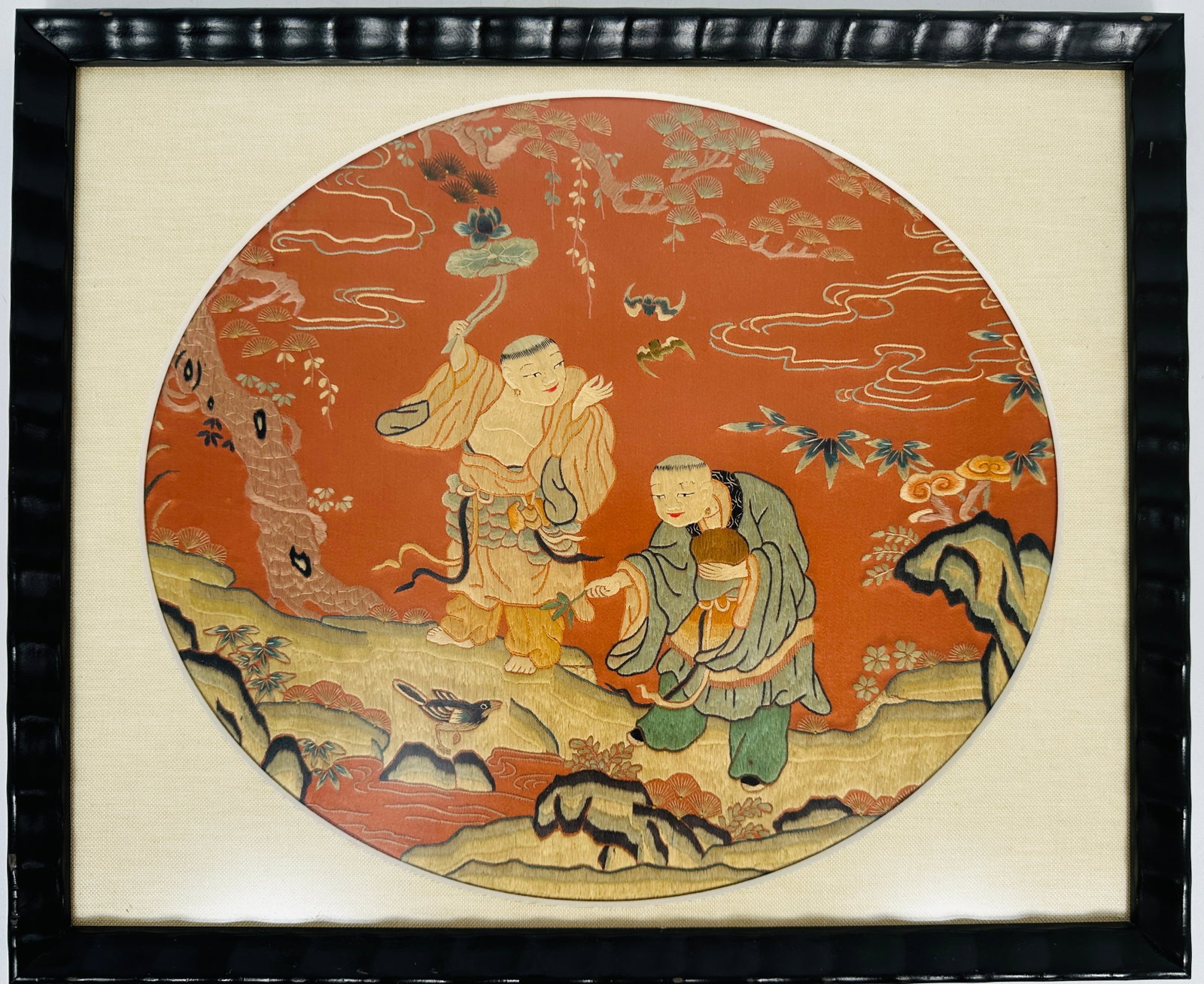 A Chinese Embroidered Silk Roundel 'He He Er Xian' Panel: Frame: 17.25 in. wide, 14.25 in. high