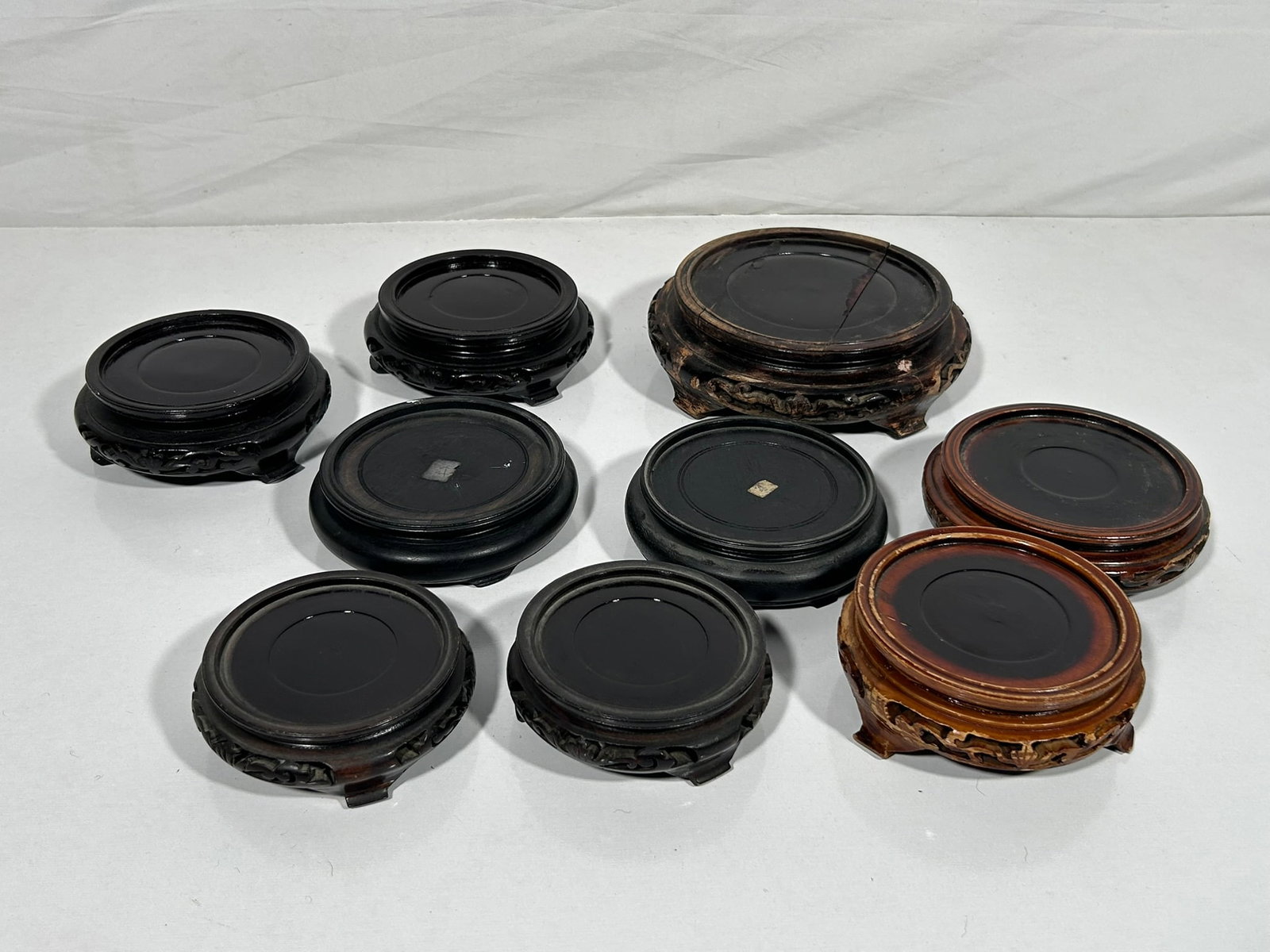 A Group of Seven Chinese Wood Stands: Largest one: 7.25 in. diameter