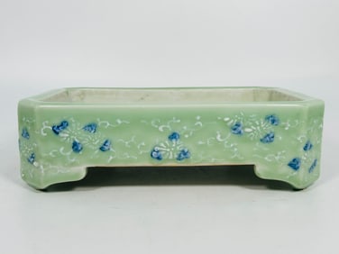 A Japanese Celadon-Glazed and Underglazed-Blue-Decorated Rectangular Jariniere