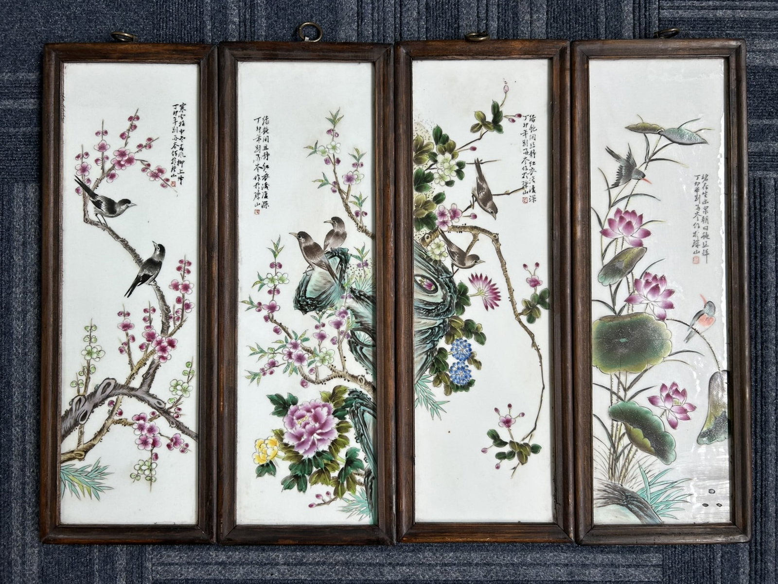 A Set of Four Porcelain Inset 'Bird and Flower' Wood Panel: Depicting birds standing on various types of flower branches, inscribed and signed by Liu Yucen. 23.1/4 in. x 8.1/8 in. each with frame.