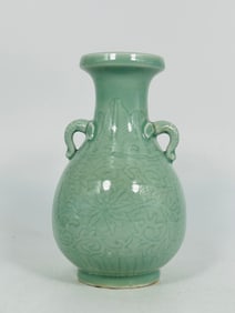A Chinese incised Celadon-Glazed Twin-handled Vase, Yongzheng Six-Character Mark