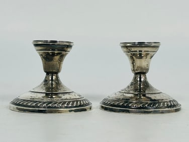 A Pair of Sterling Silver Candlesticks