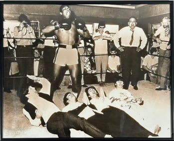 A Photo Print of Muhammad Ali Over The Beatles, with a Signature Muhammad Ali
