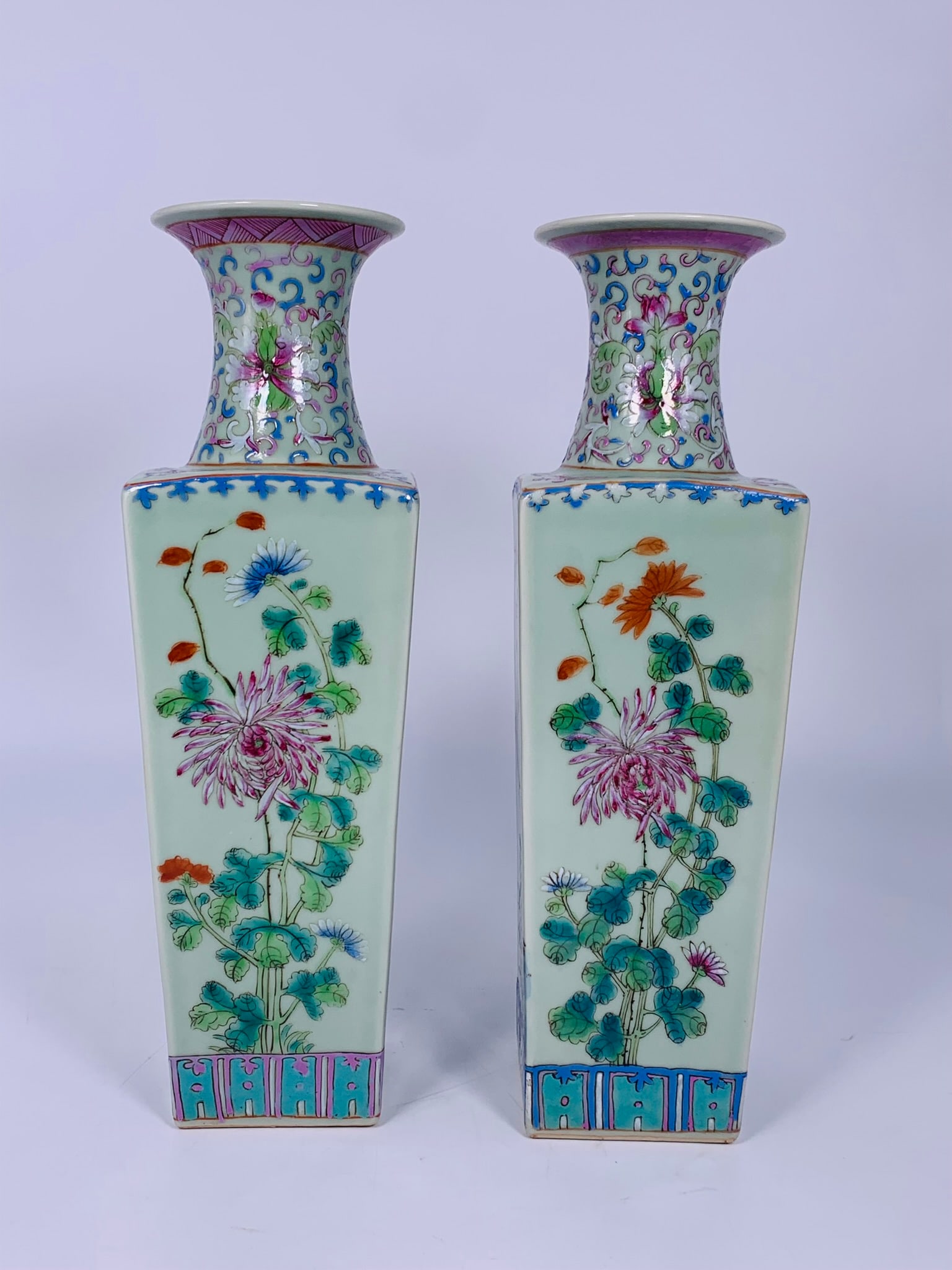 A Pair of Chinese Famille Rose Celadon-Ground 'Flower' Square Vases: 13 in. high, 3.3/4 in. square each.
