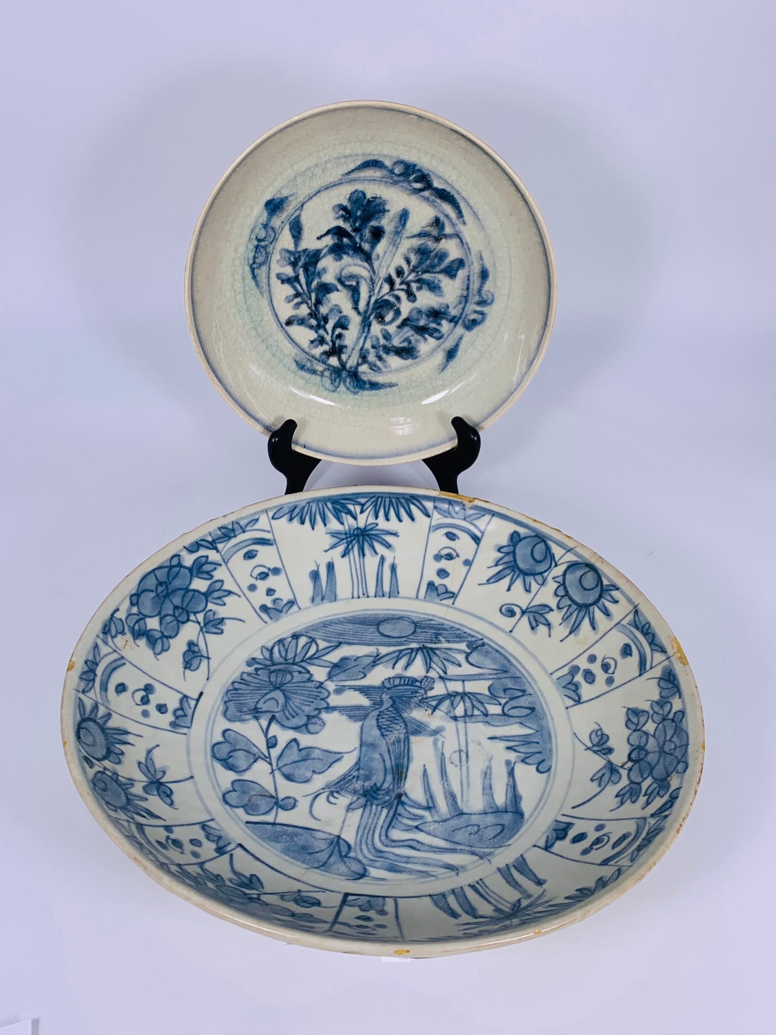Two Chinese Blue and White Kraak Dishes, Ming Dynasty: The larger one measures 13.3/8 in. diam.; the smaller one measures 9.5/8 in. diam.
