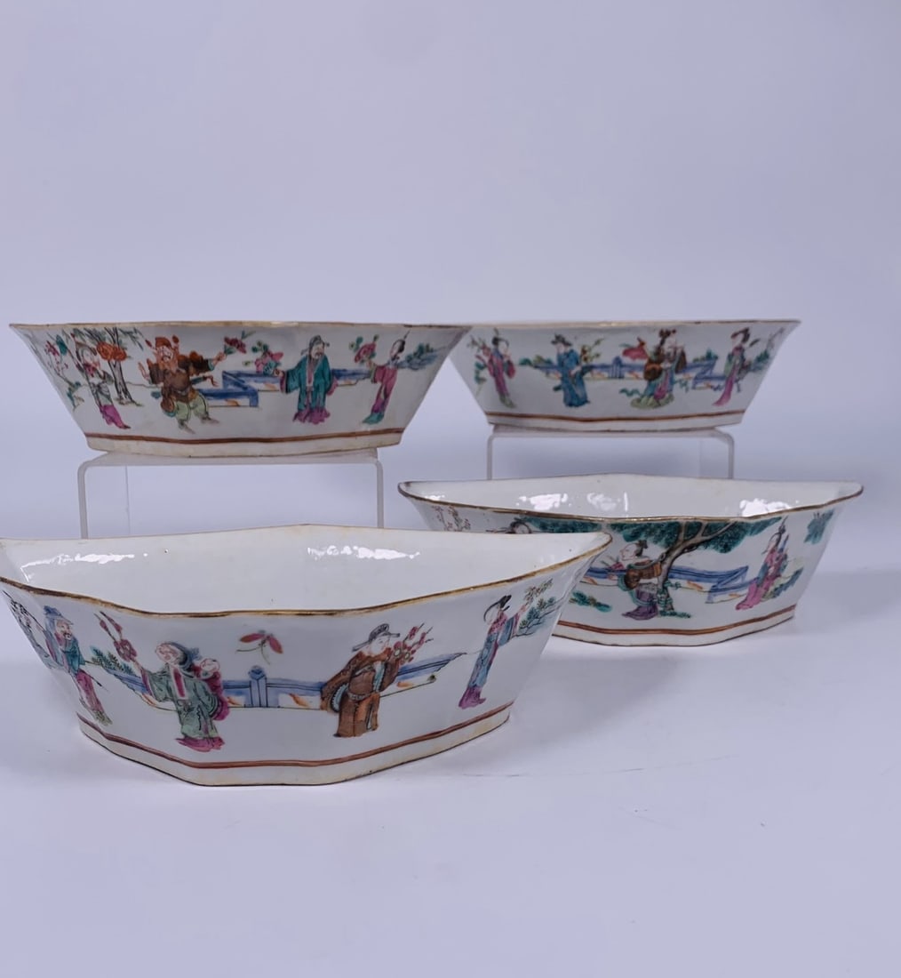 A Set of Four Famille Rose and Iron-Red-Decorated 'Figural and Bats' Bowls, Late Qing Dynasty: Each decorated with figures in landscape setting on one side and two bats on the other side; 2.1/4 in. high, 8.5/8 in. wide each.