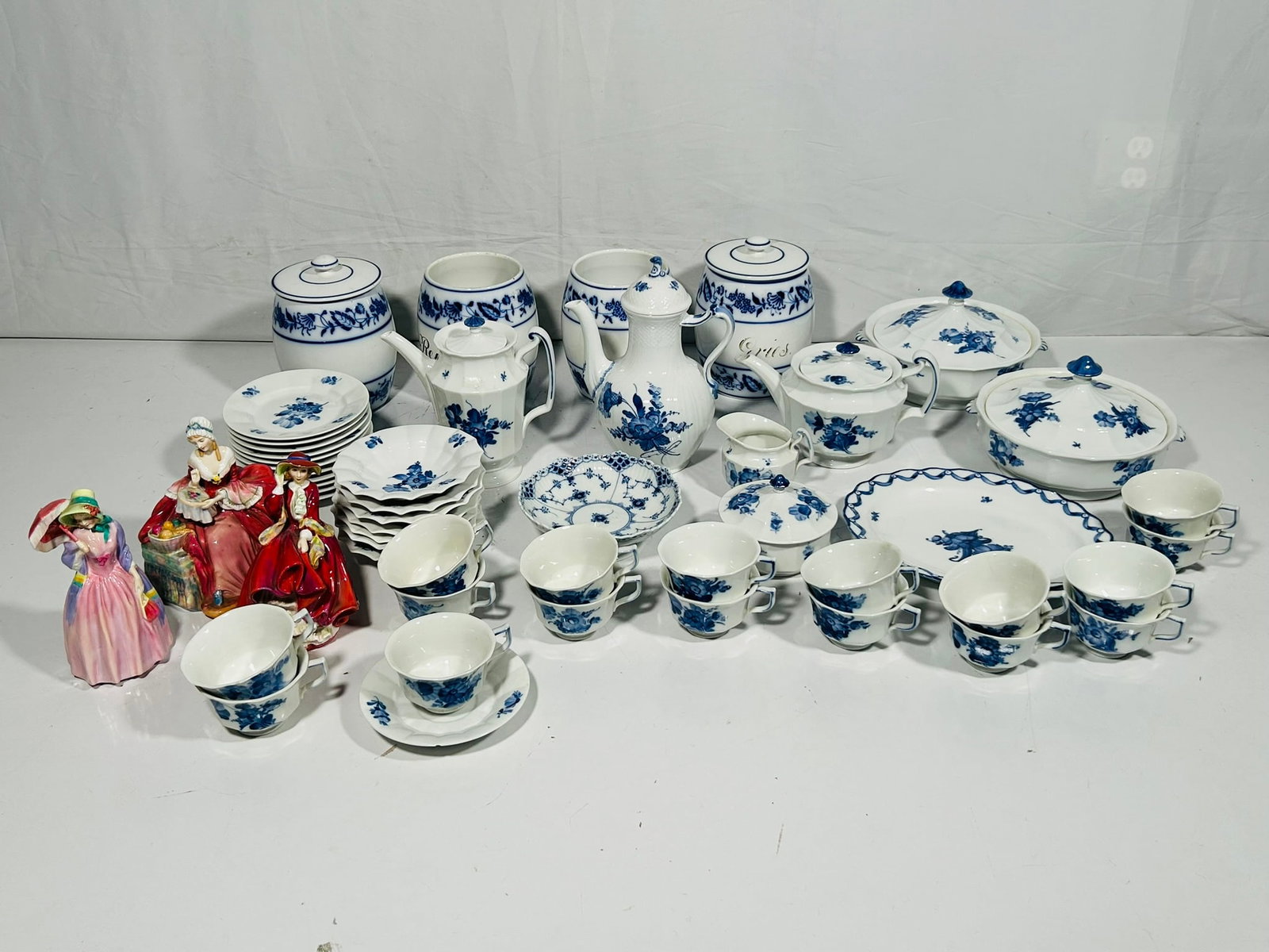A Group of Fifty-Two Porcelain Objects, Royal Copenhagen and Royal Doulton: Comprising a Royal Copenhagen flower braided coffee pot, model number 10/1794, 10 in. high, 7.1/2 in. wide; a Royal Copenhagen fluted half lace dessert dish, model number 1/511, 2.1/4 in. high, 6.3/4 
