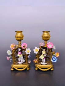 A Pair of Gilt-Bronze and Porcelain Hand Candlestick Holders