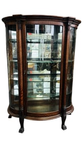 An Antique Oak Curved Glass Curio Display Cabinet