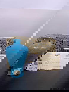 Christie's and Sotheby's Provenance: A Small Robin's-Egg-Glazed Vase, Meiping, Yongzheng Mark and of: Rising to a broad shoulder, topped with a short neck and a lipped rim, the surface is generously covered with a vibrant opaque sky-blue glaze, accented by purplish-blue cascades. The recessed base bea