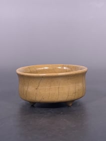 A Chinese Yellow-Glazed Tripod Censer