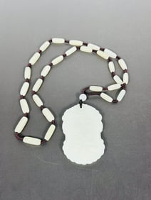 A String of Chinese White Jade Beads and a Plaque, Necklace