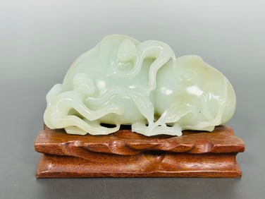 A Chinese White Jade 'Monkey and Peach' Group