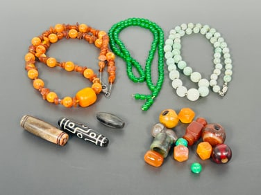 A Group of Three Necklaces and Fifteen Beads