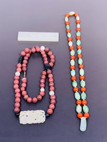 Two Necklaces and a Jade Paperweight
